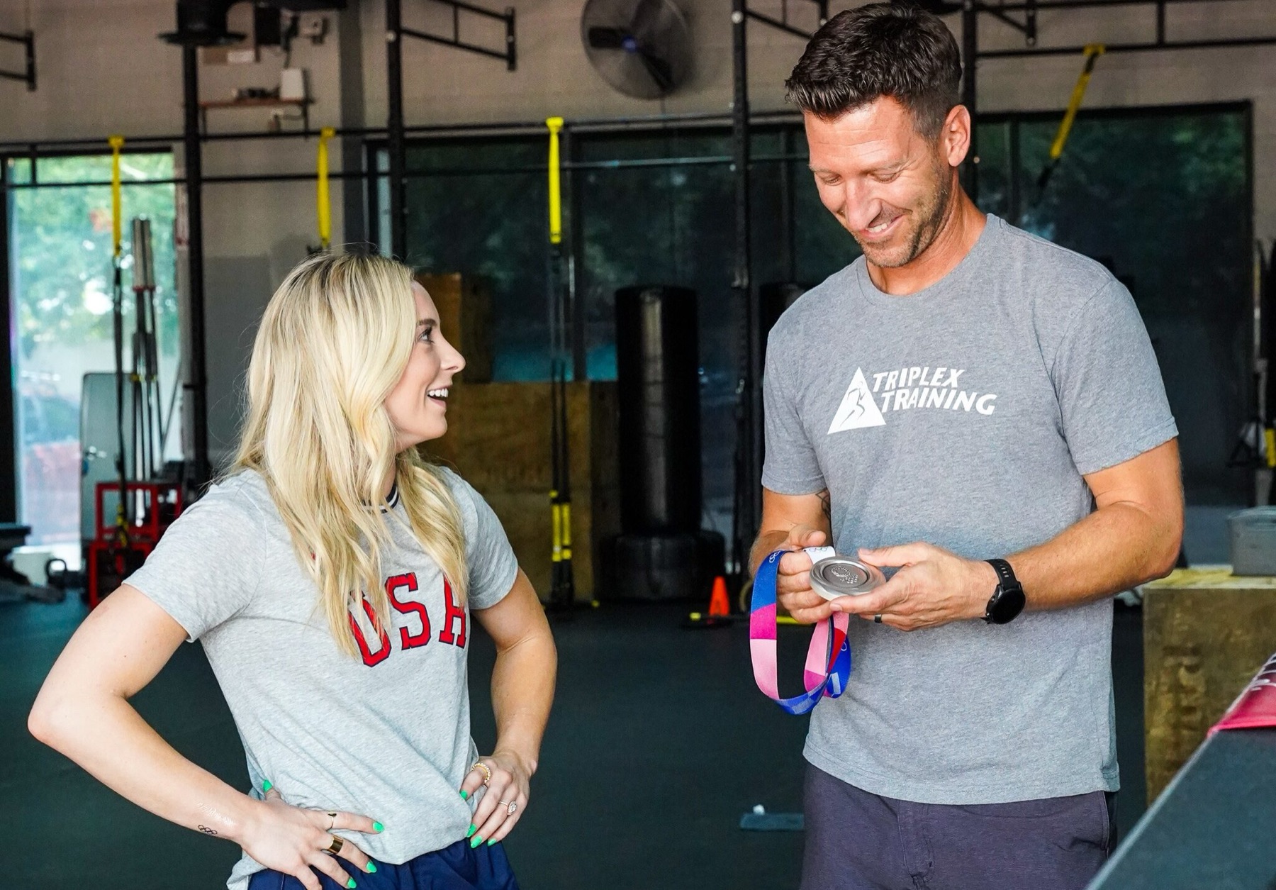 A Triplex coach checking in with an athlete